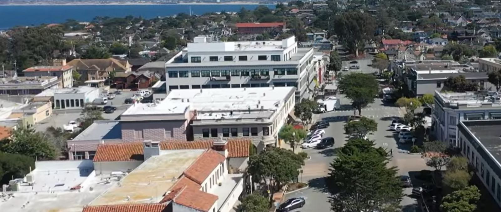Downtown Pacific Grove storefronts and sidewalks near the breakfast stops.